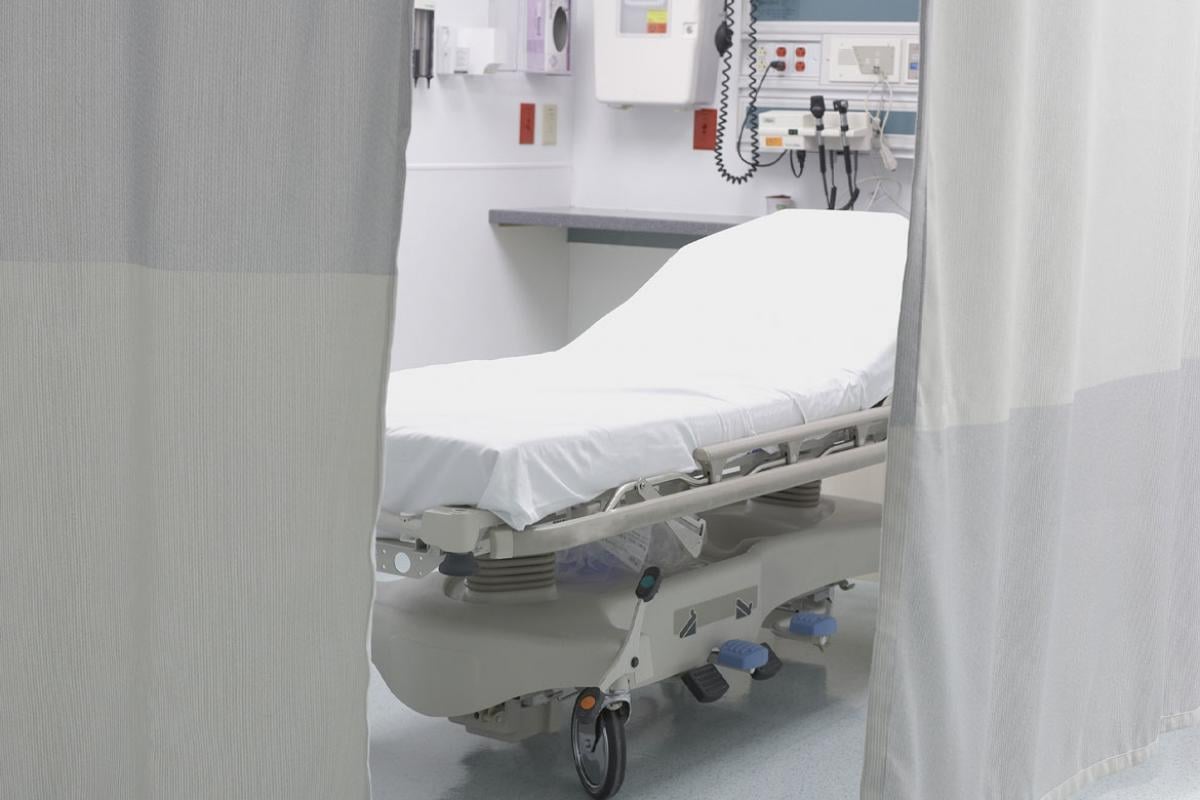 Empty emergency room hospital bed