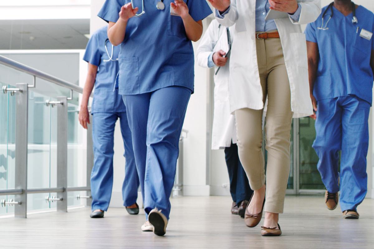 Group of medical practitioners walking in a hospital
