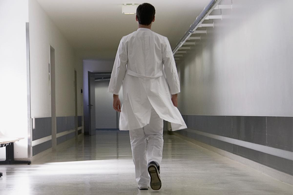 Doctor walking down corridor