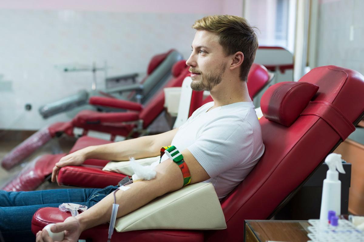 Blood donor making donation in hospital