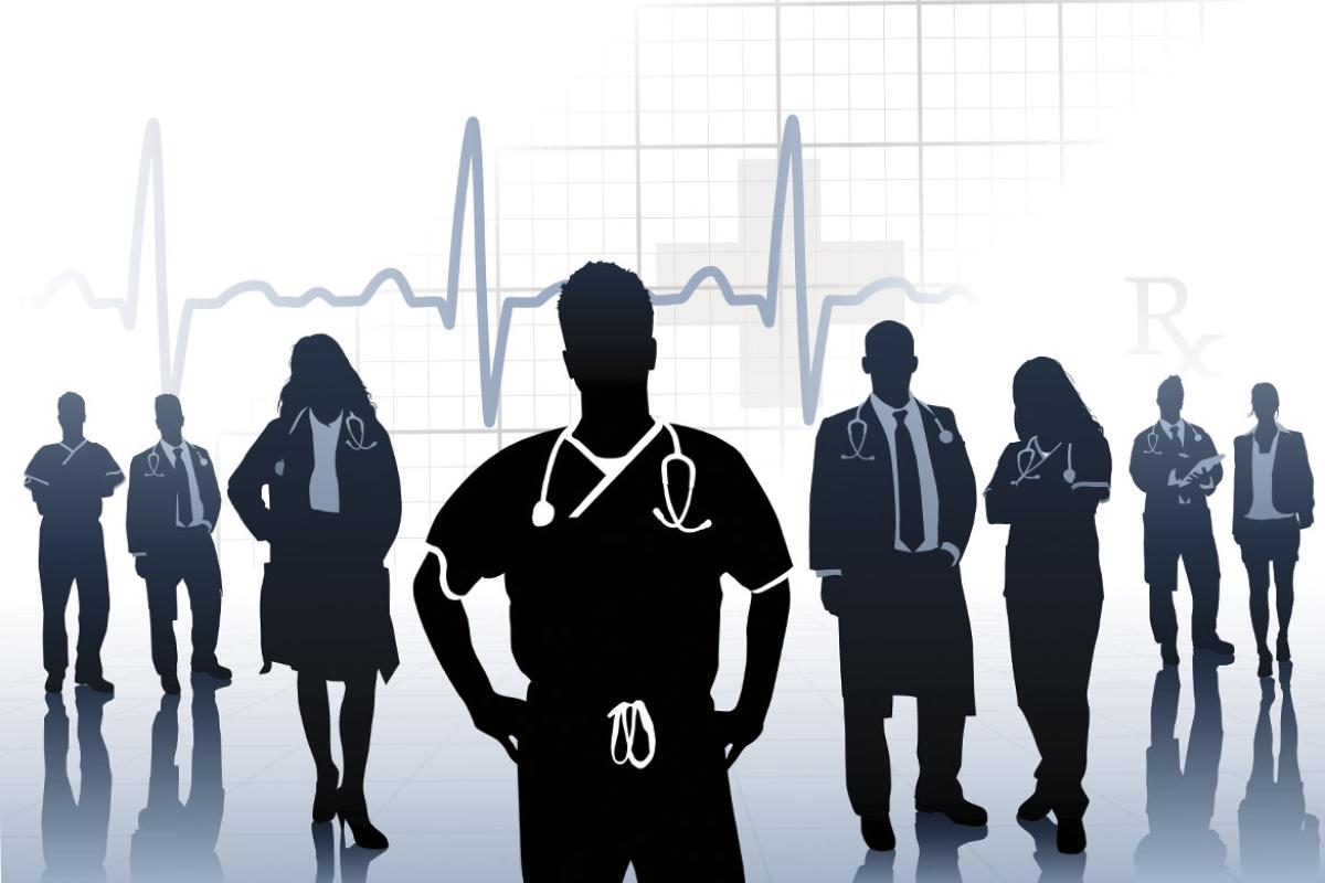 Silhouettes of a group of physicians and health care providers 
