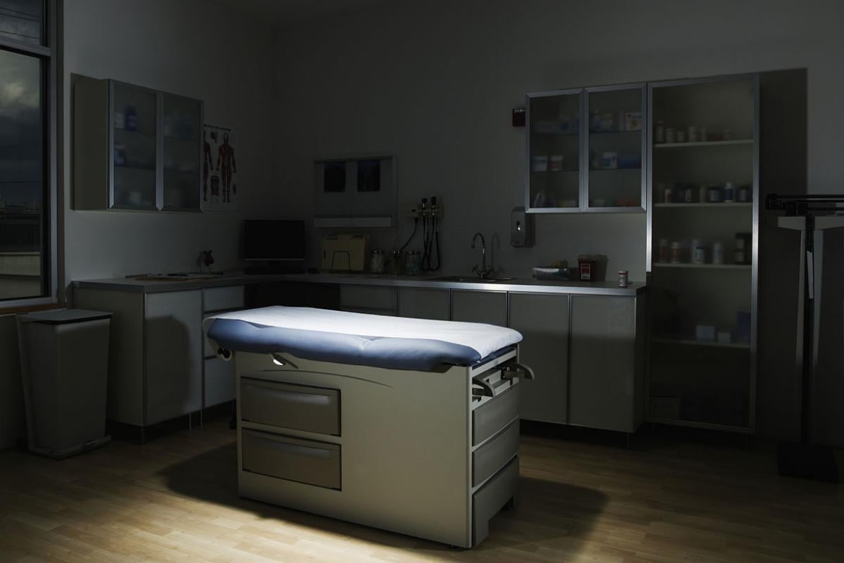 Empty, dimly lit examination room