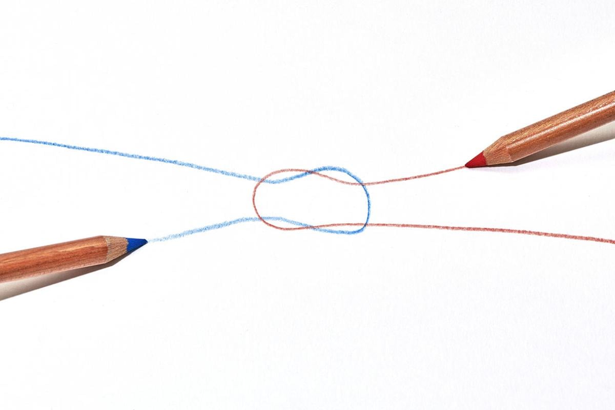 Two pencils drawing a knot