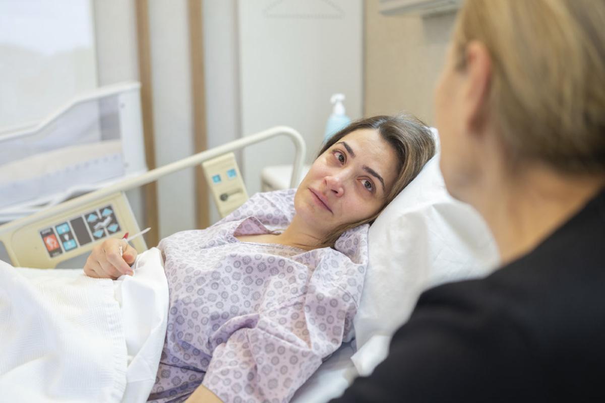 Female patient in a hospital bed