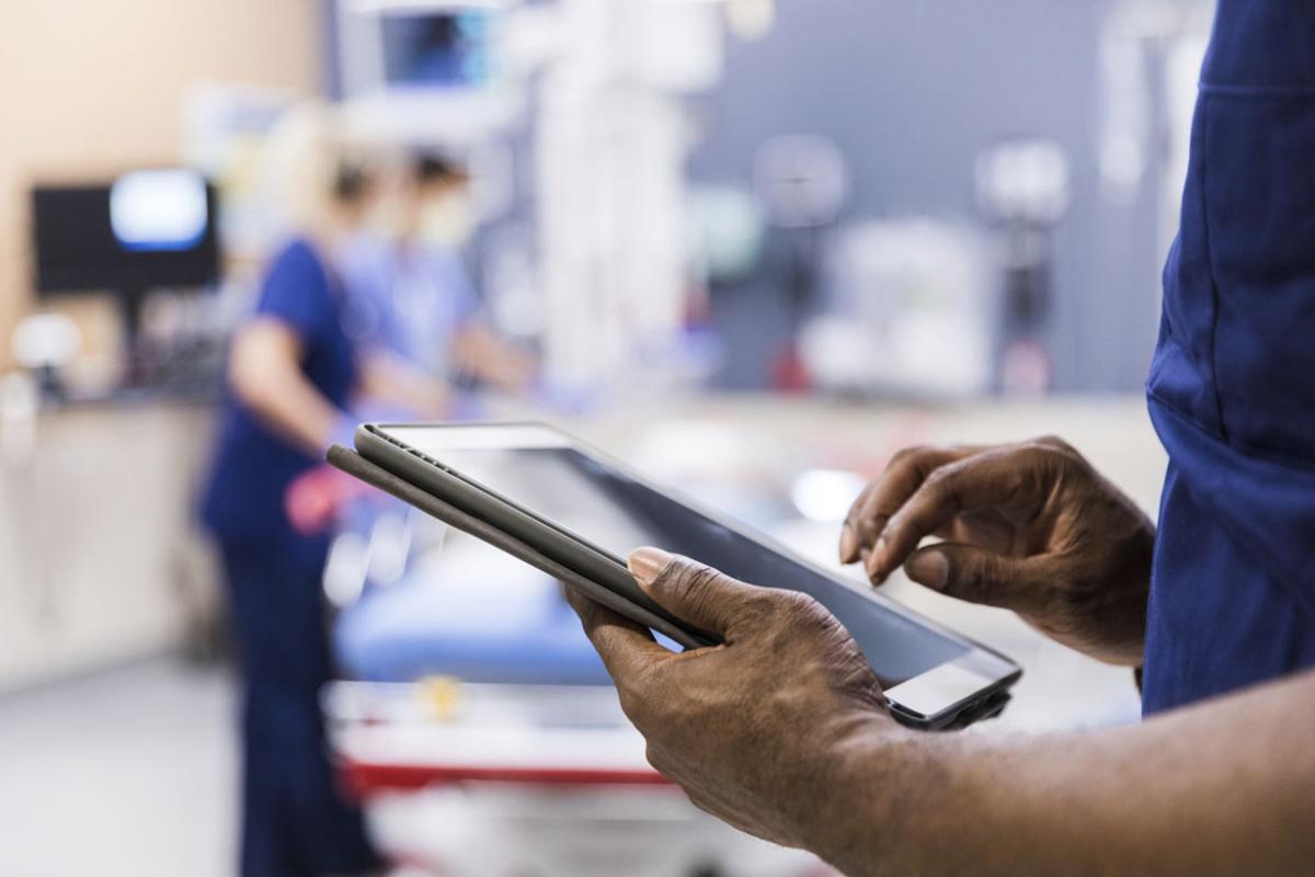 Medical staff uses digital tablet