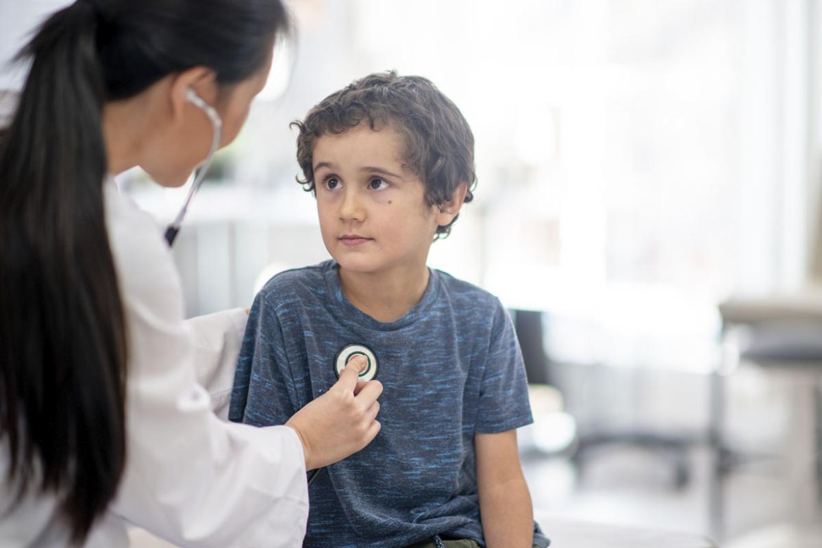 Young patient being examined by physician