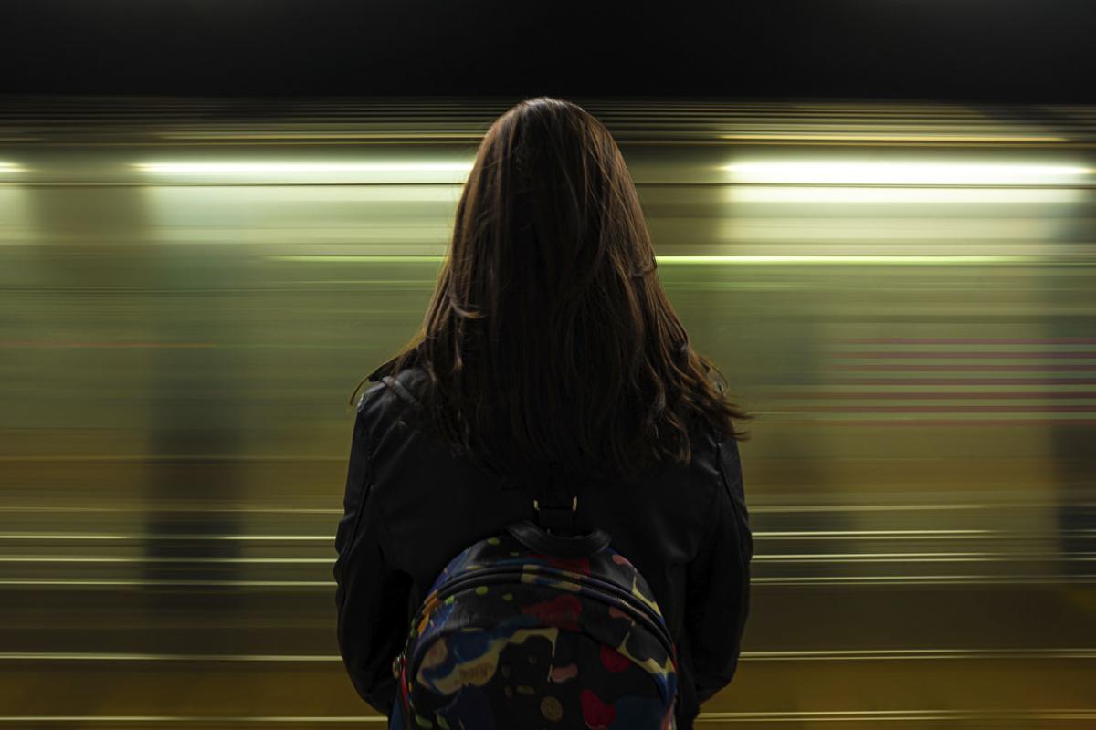 Woman watching the subway passing 