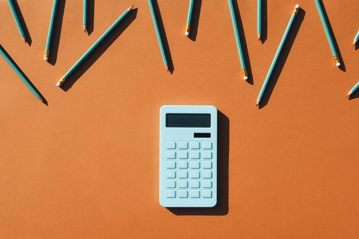 Calculator surrounded by pencils