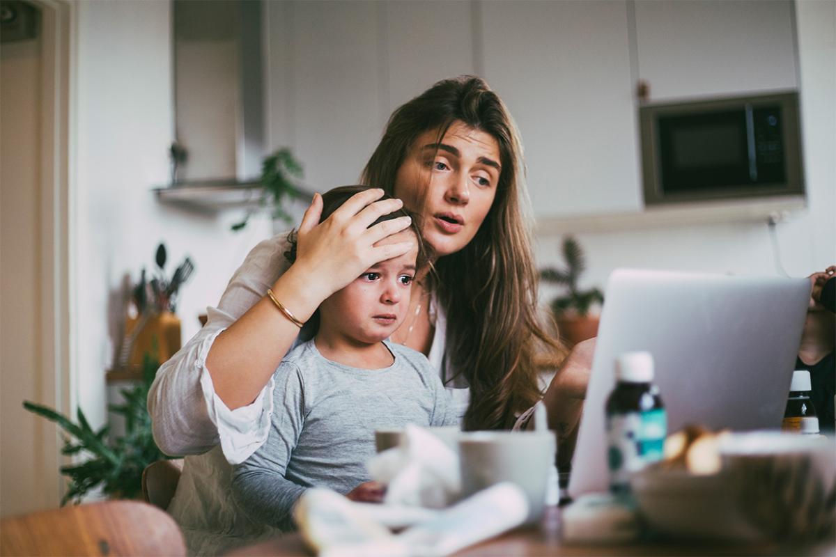Parent and child in a telehealth appointment