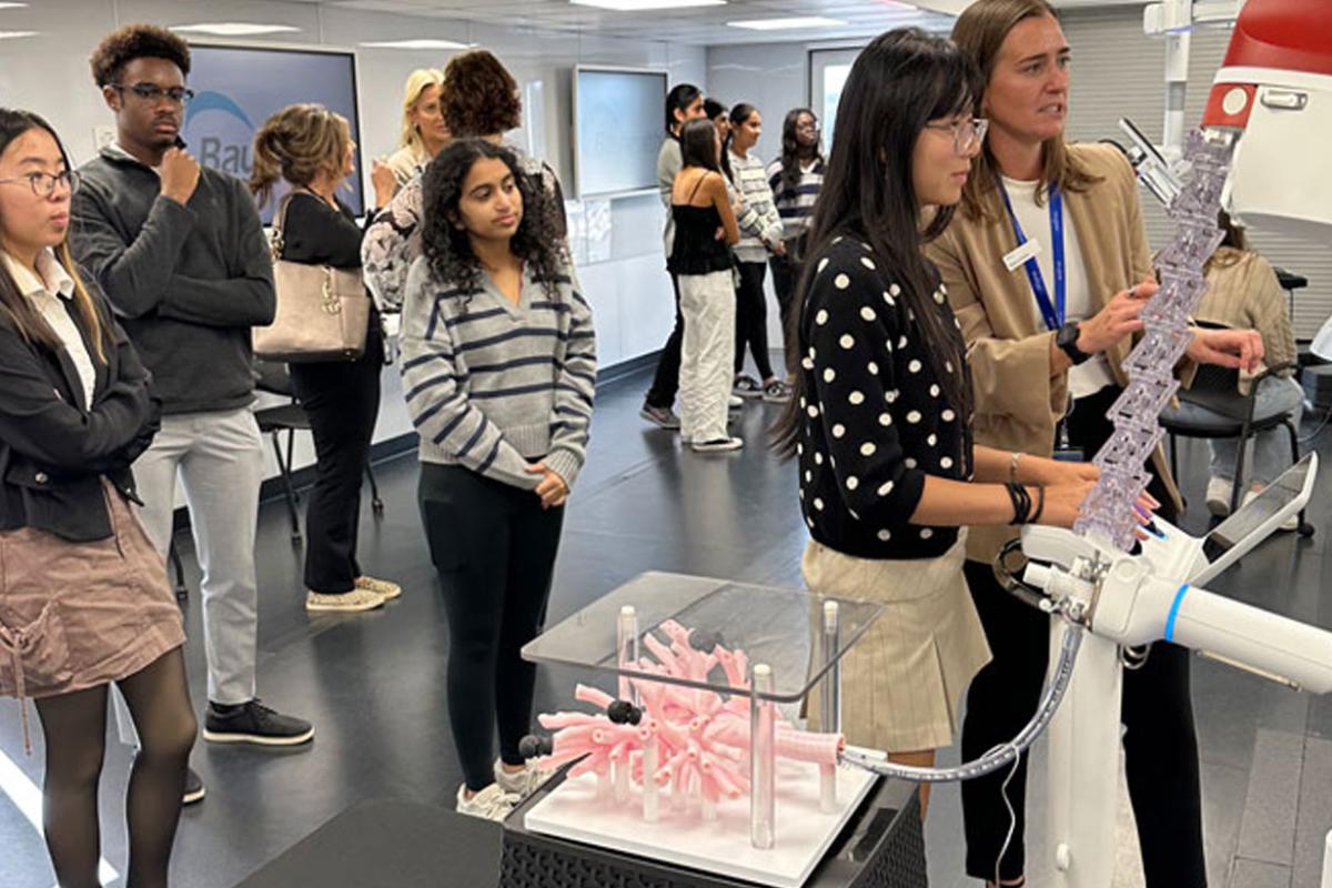 A high school student drives the Ion through artificial lungs in the TOME Truck