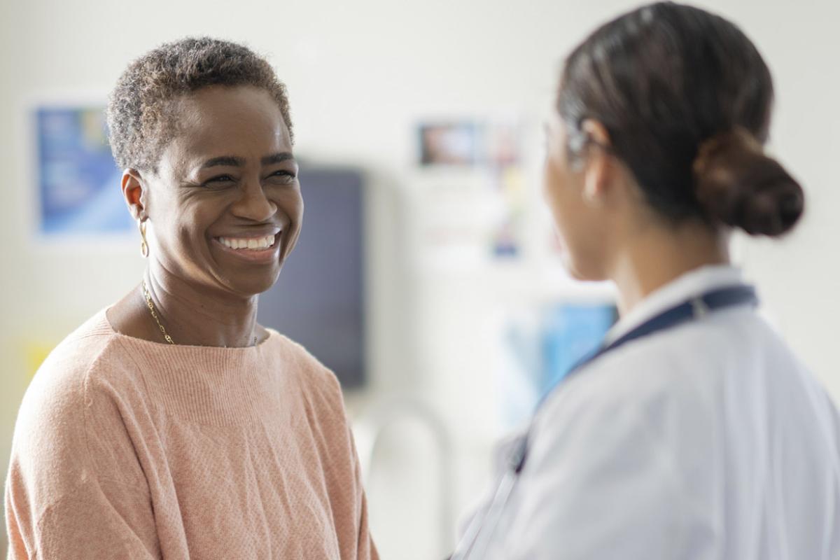 Smiling patient with doctor