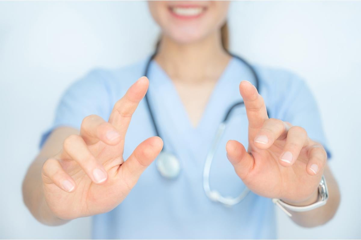 Health care worker with pointing gesture