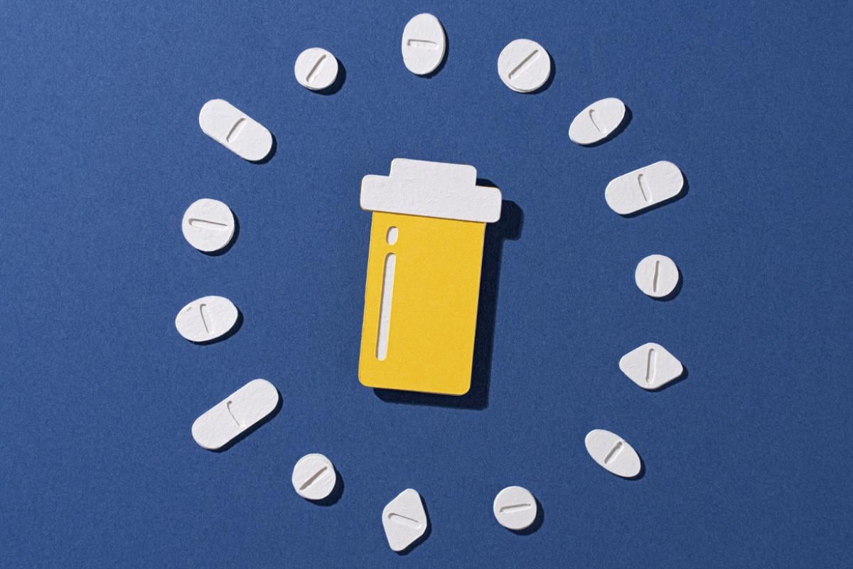 Prescription pill bottle with pills surrounded in a circle