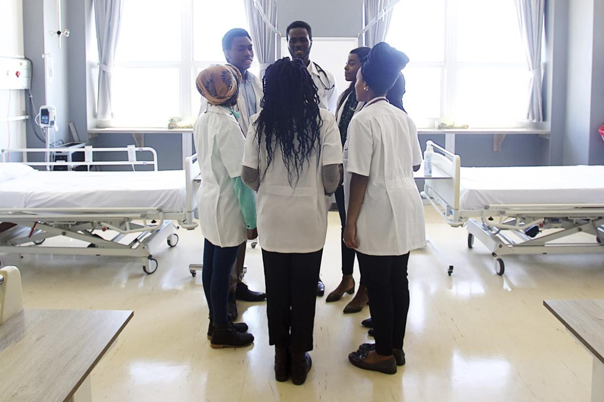 Medical students standing together in a circle