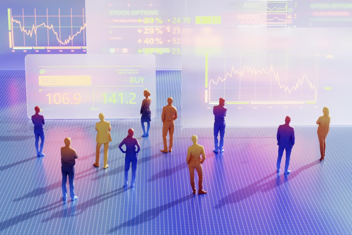 Figures stand in front of large data graphs