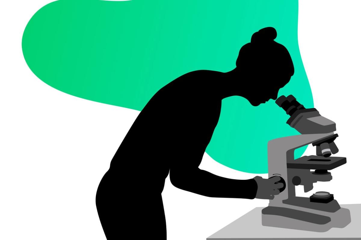 Figure looking through a microscope