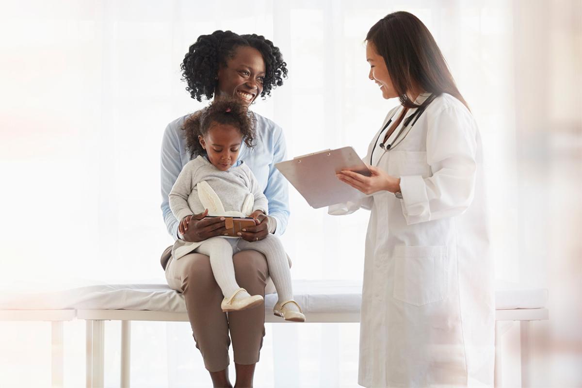Mother and child consulting with a pediatrician