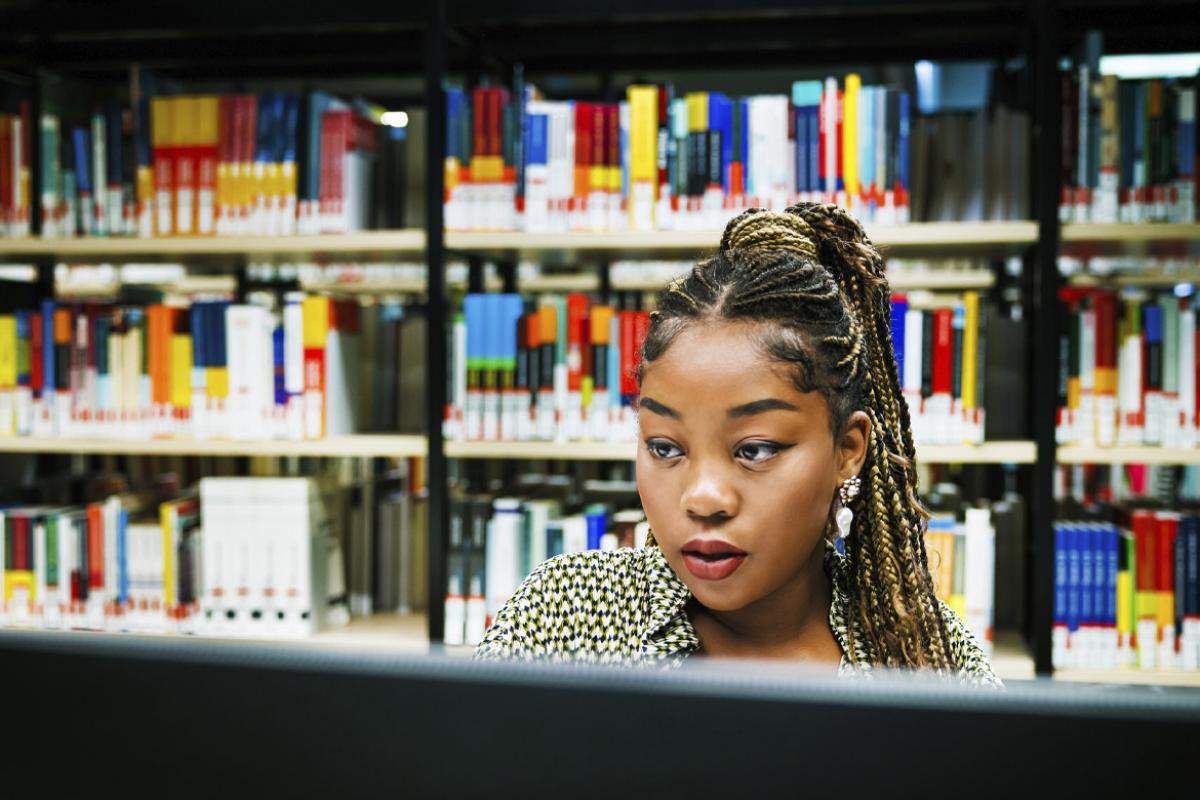 Woman studying in a library