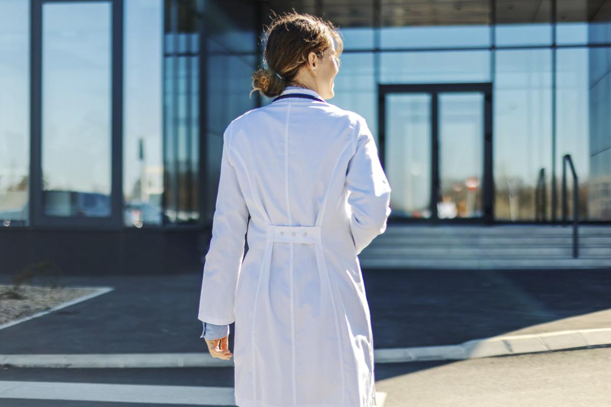 Doctor walking towards building