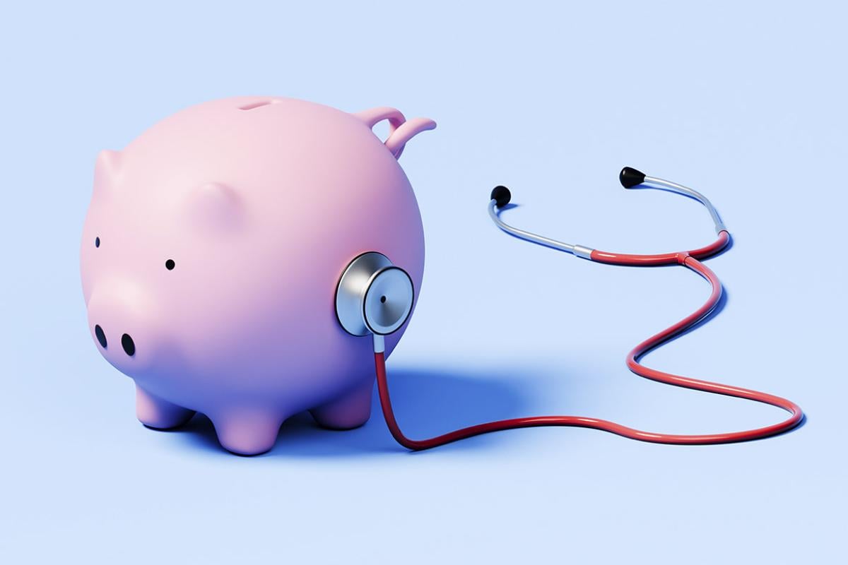 Stethoscope on a piggy bank