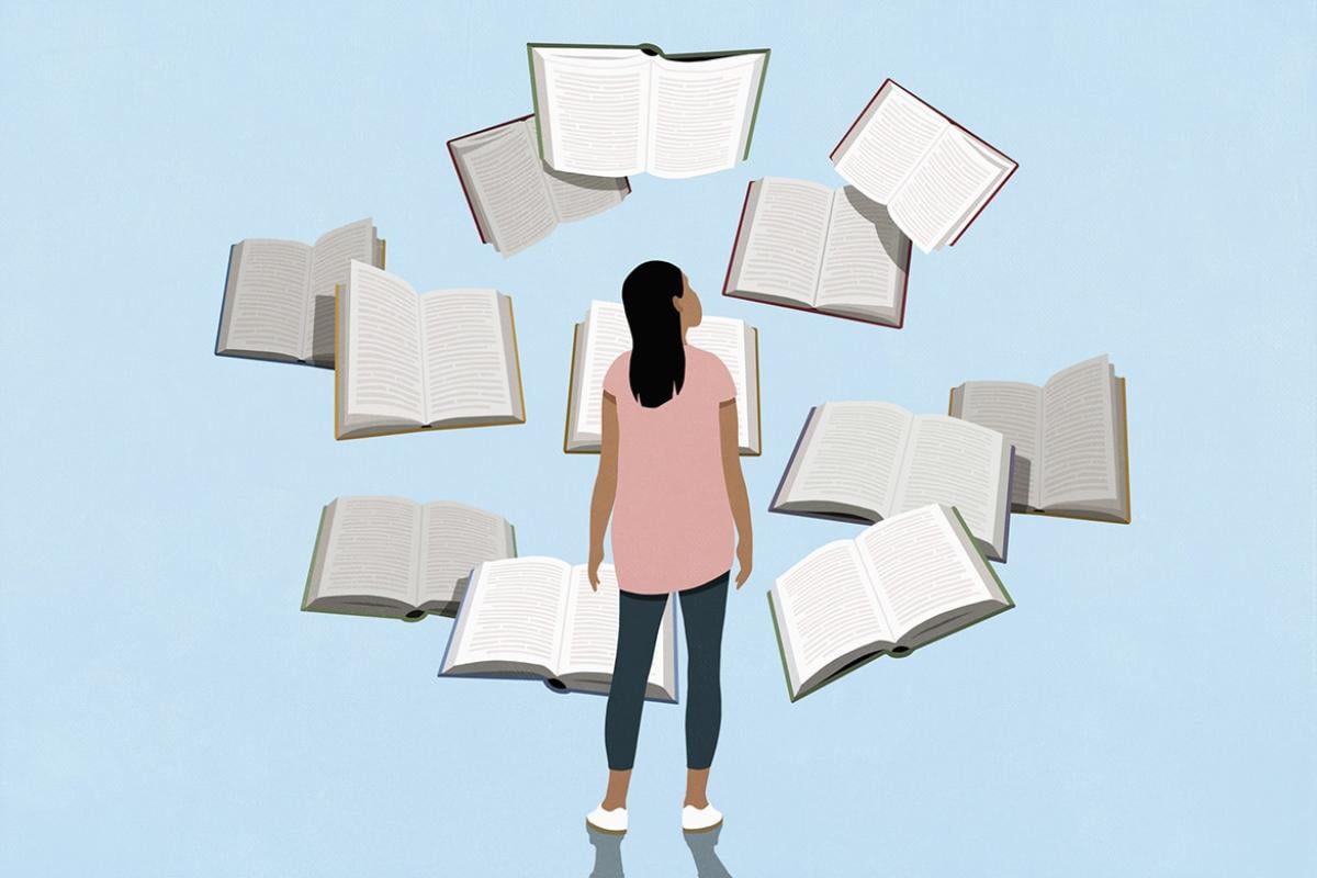 Figure surrounded by books