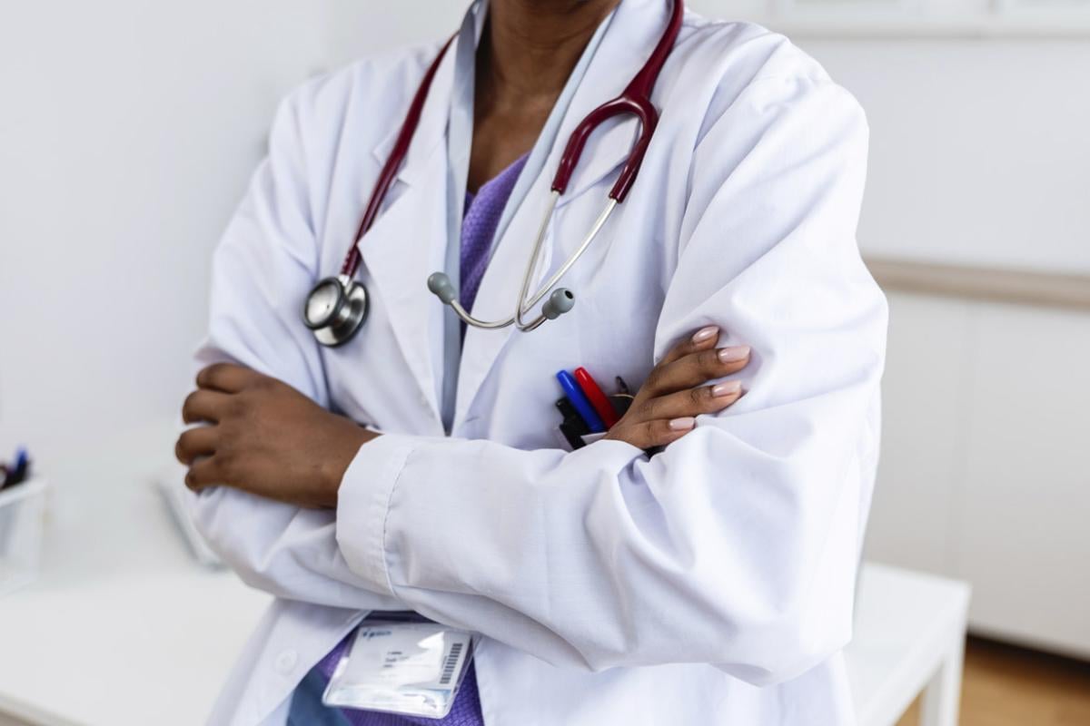 Physician with arms crossed