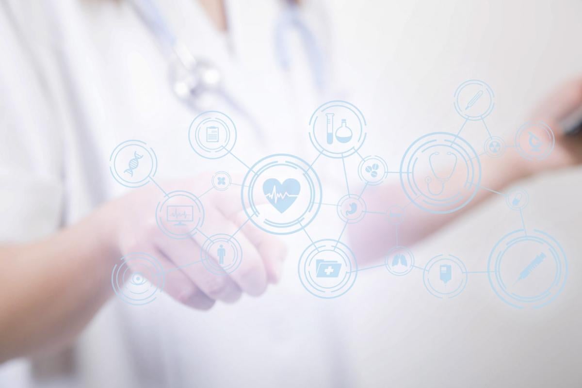 Physician points to virtual health icons