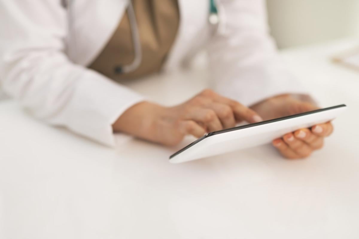 Physician uses a tablet