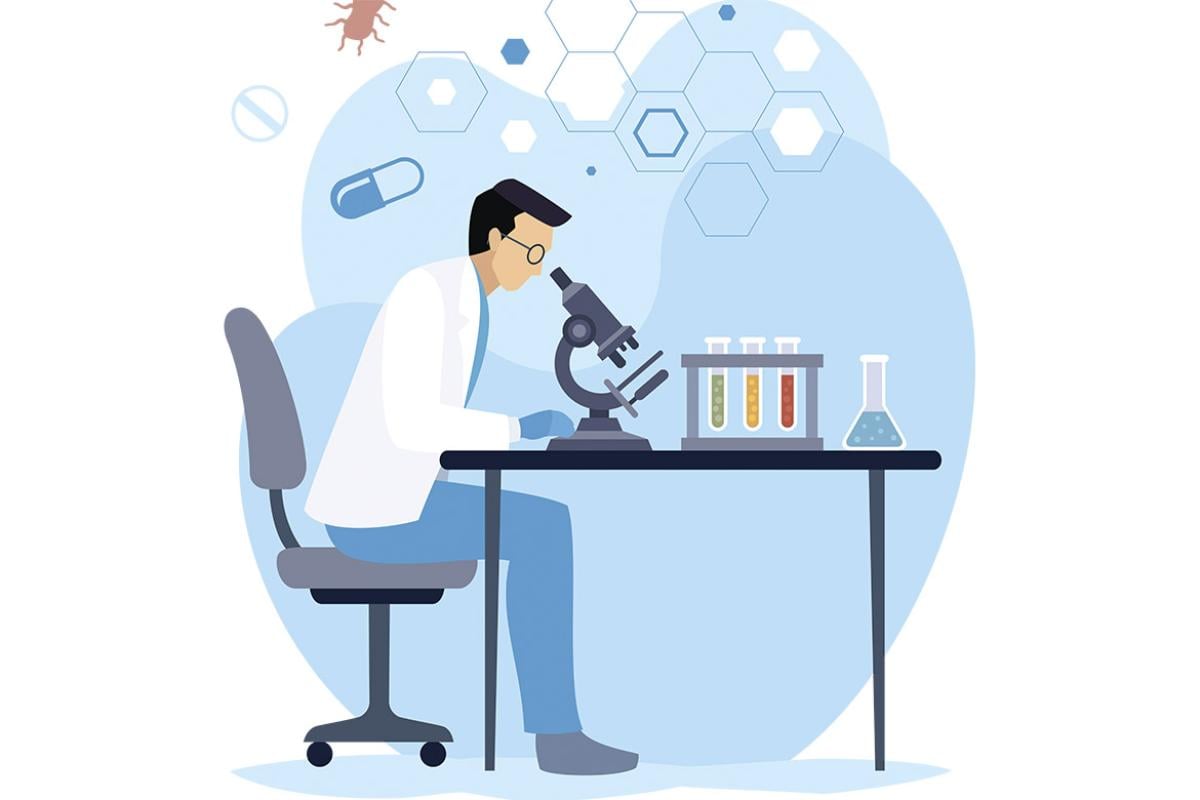 Scientist looking through microscope