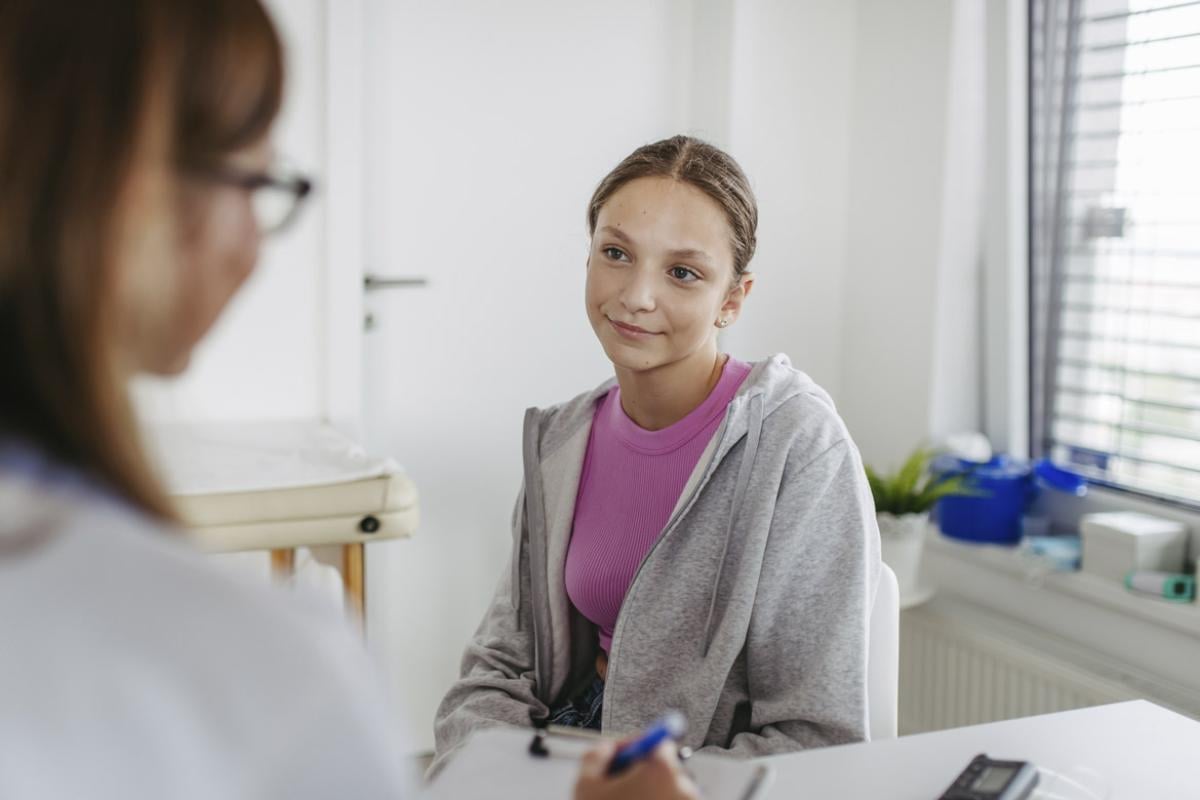 Young woman with physician