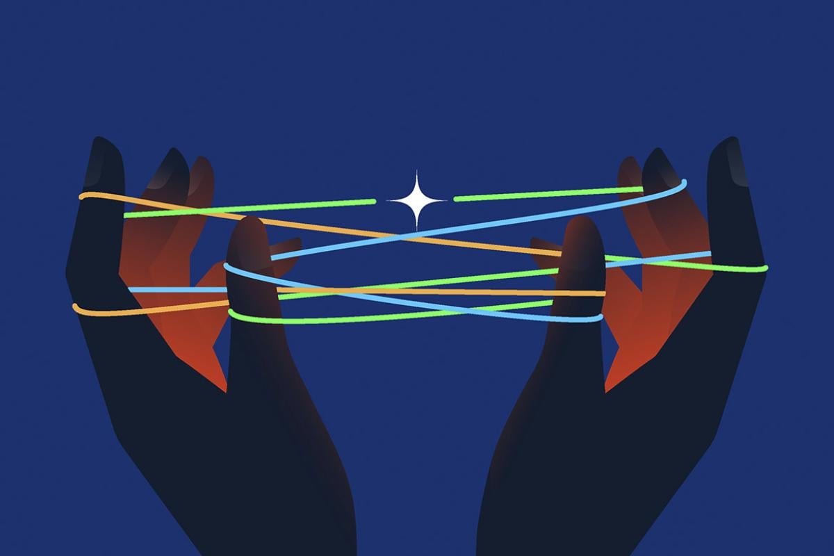Hands holding string in cat's cradle