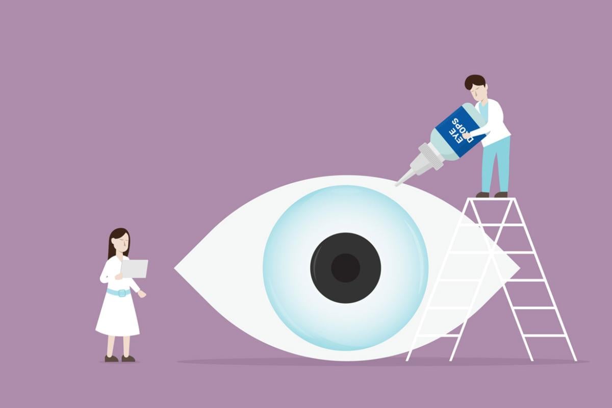 Two figures treat a giant eyeball