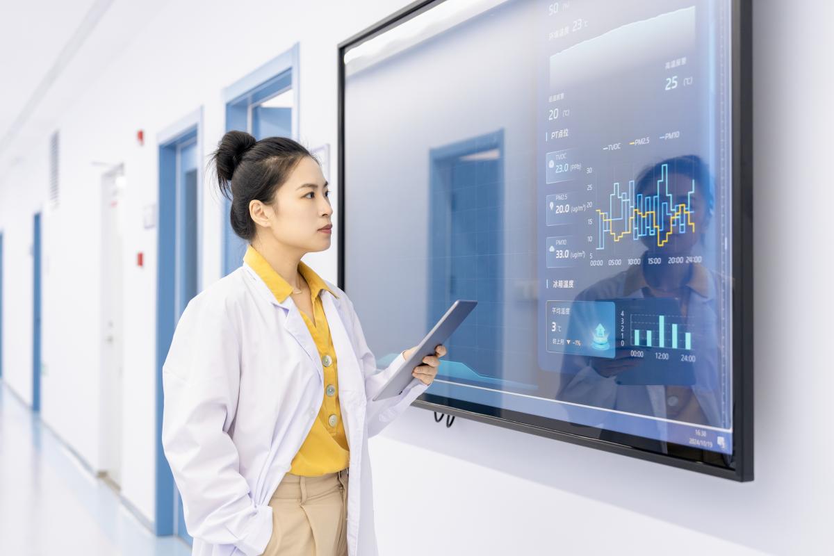 Doctor looking at data on a screen