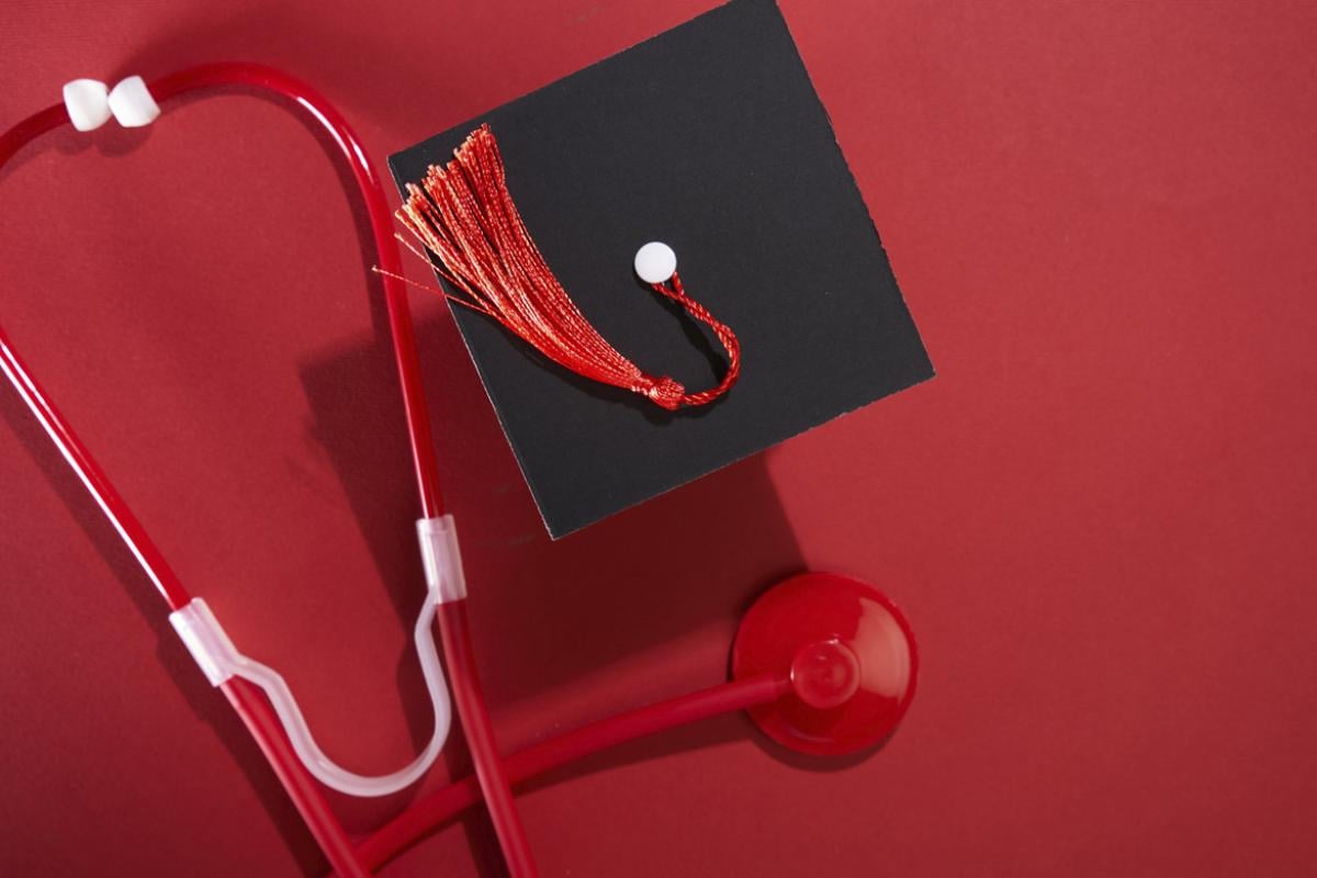 Graduation cap next to stethoscope