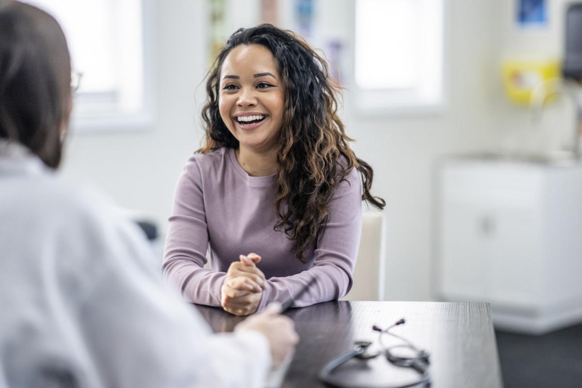 Smiling patient with physician