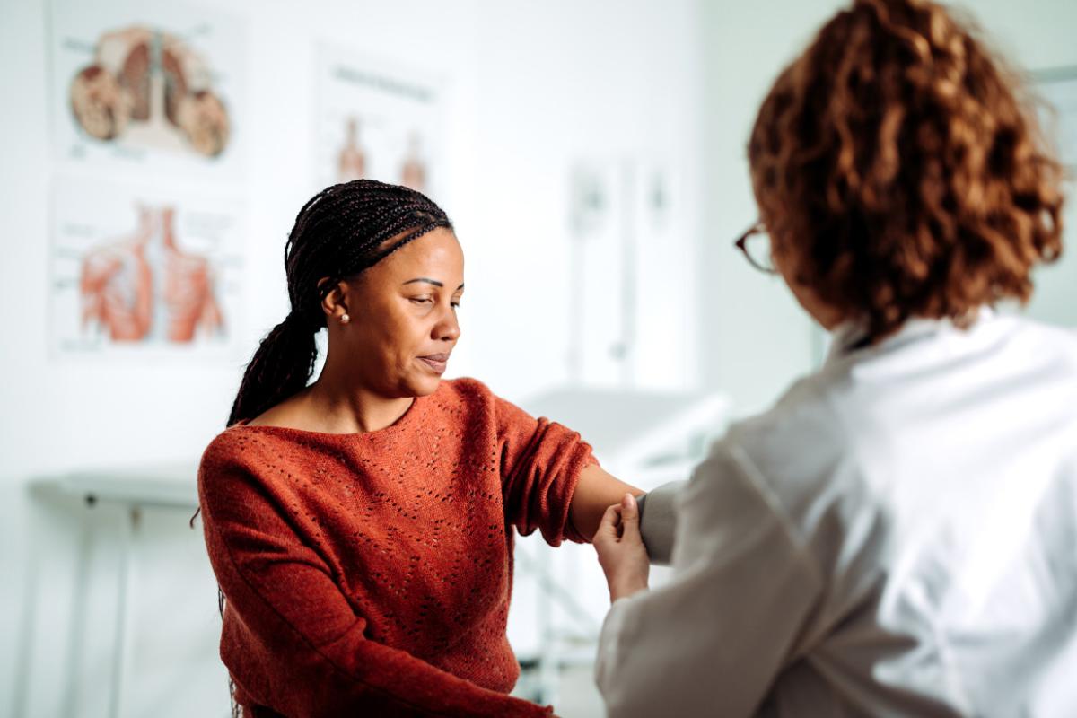 Patient getting blood pressure checked during doctor's appointment