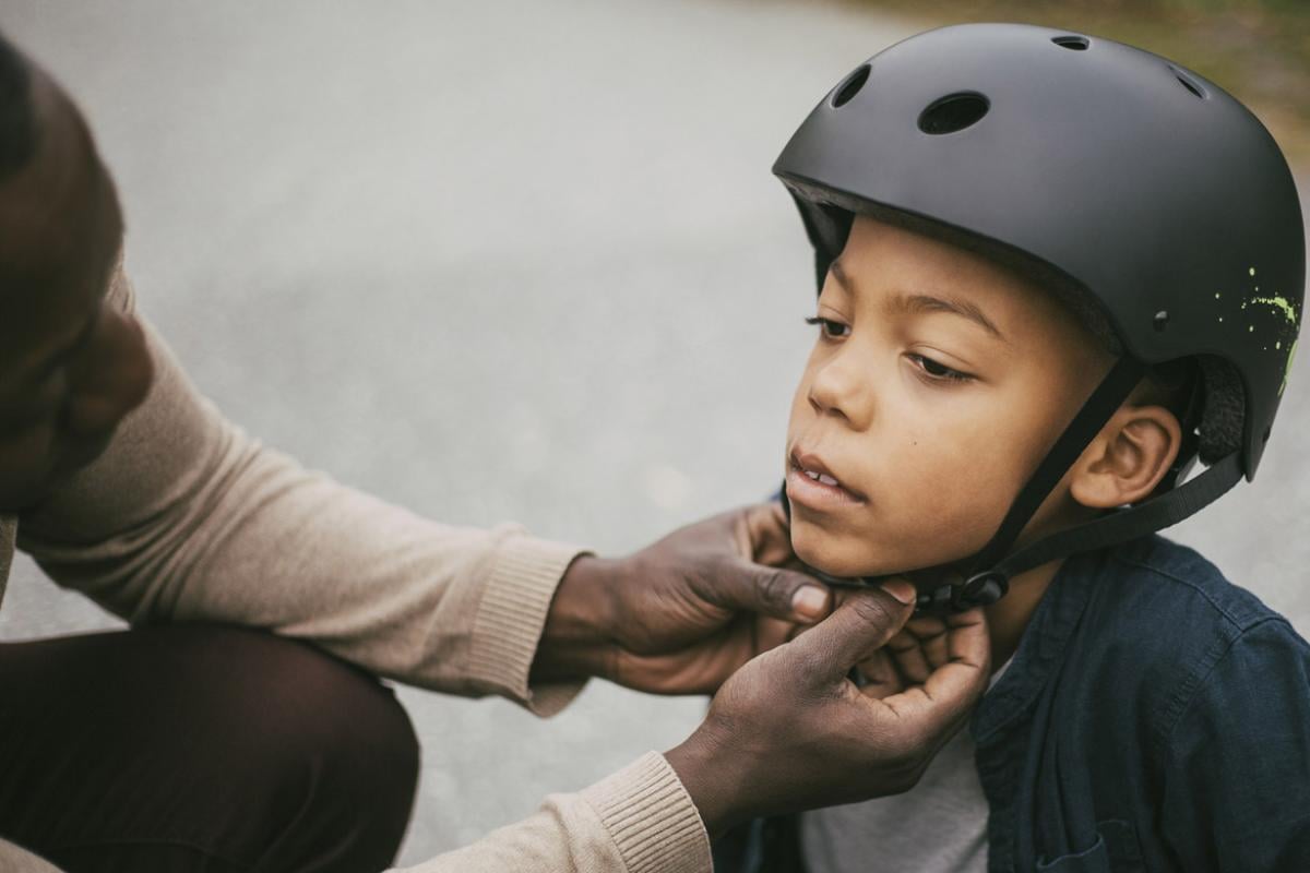 Child is fitted with a helmet