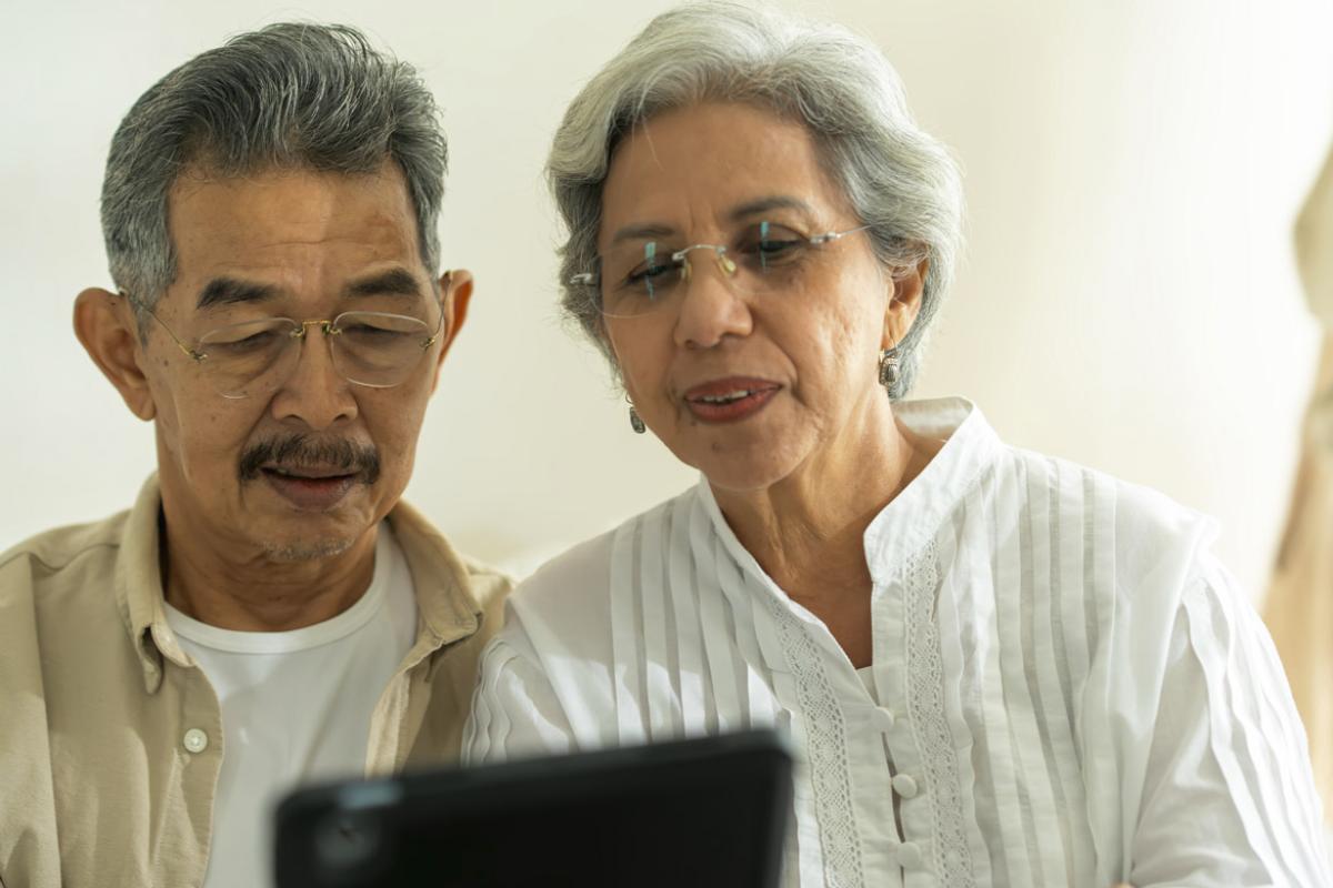 Couple looks at a tablet