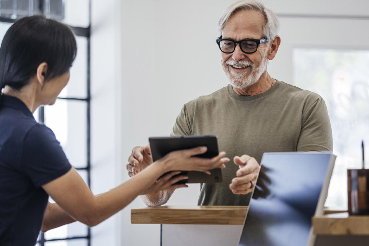 Two people using a tablet