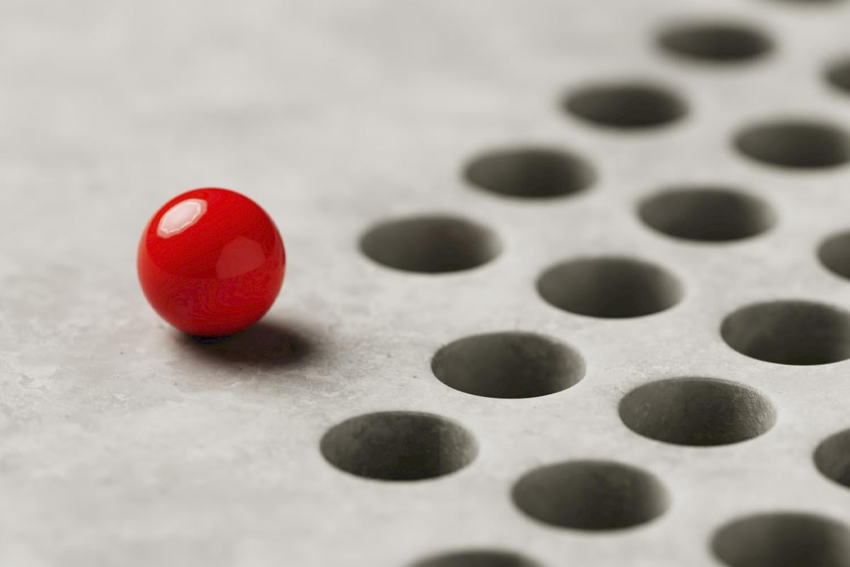 Ball sits before a series of holes