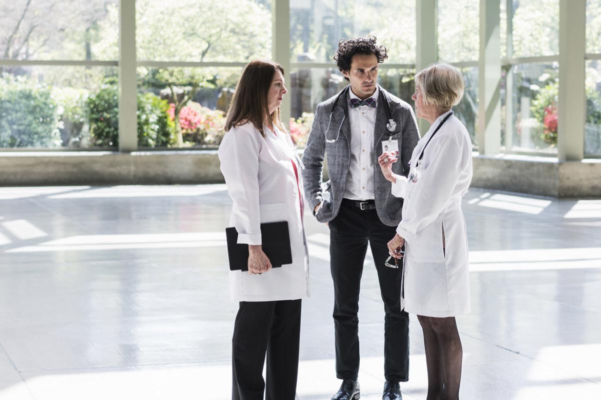 Three physicians in discussion