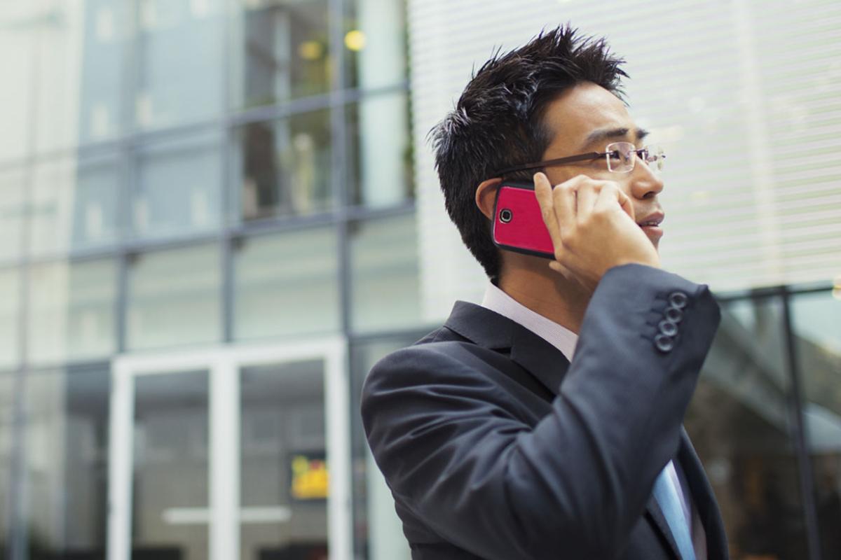 Man speaking into his cellphone. 