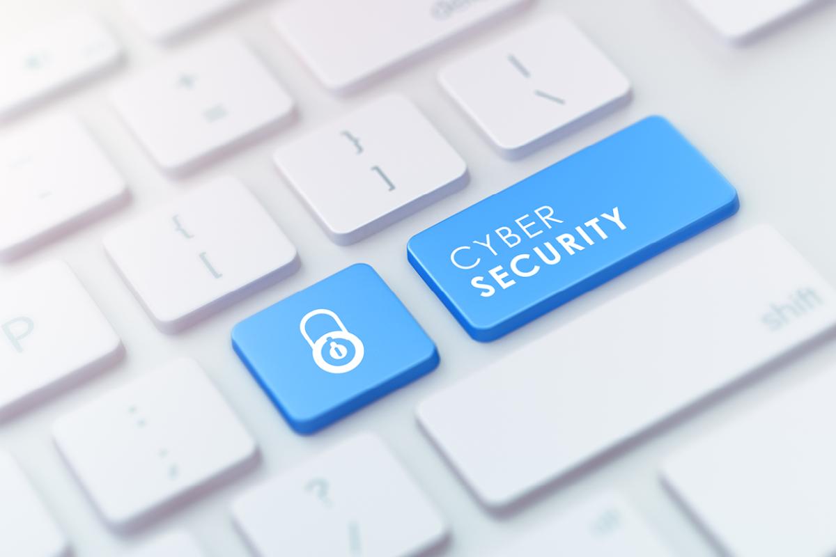 Two blue buttons on a computer keyboard - one with a lock sign, one with the words 'Cyber Security'. 