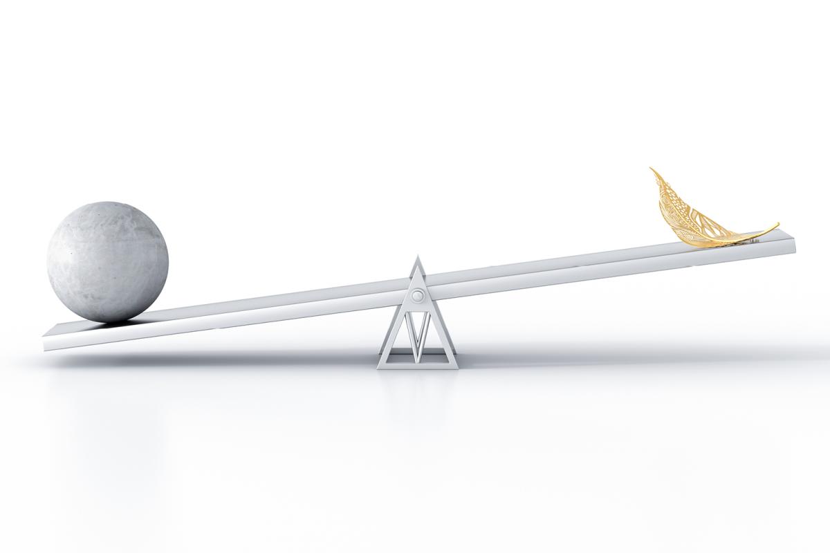 See-saw with a ball on one end and a feather on the other