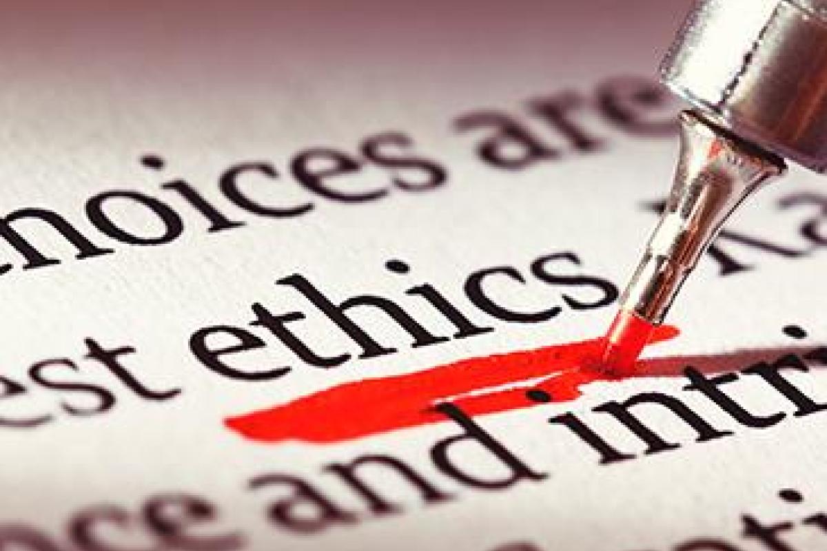 Page zoomed in on the word ethics, being underlined by a red-inked pen