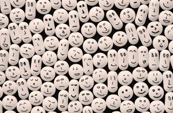 Pills with drawn smiling faces
