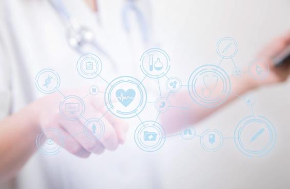 Soft focus of hands overlaid with icons