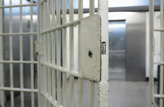 Open doors of a cell in a correctional facility or prison.