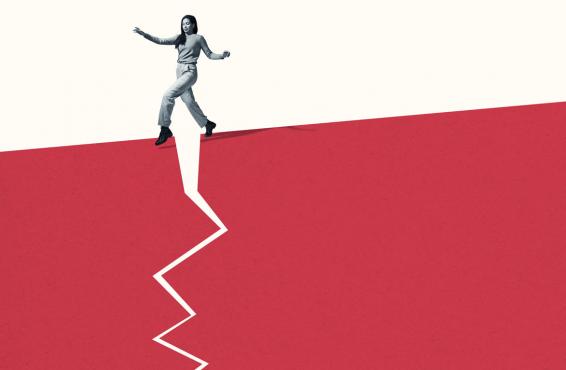 Person walking stealthily on broken red footpath 