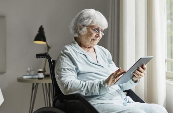 Elderly person using a tablet